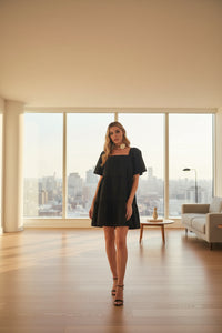 Back view of women's square neck tiered dress