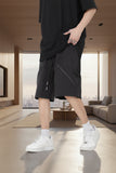 Men's black drawstring cargo shorts with pockets
