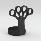 A matte black silicone ring holder with four adjustable finger rings mounted on a matching circular base, shown on a light gray gradient background.