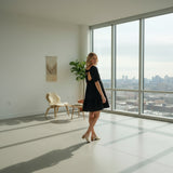 Back view of women's square neck tiered dress