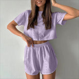 Women's crop top and slit shorts outfit