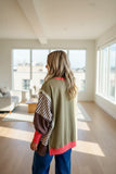 Exposed seam detail on women's striped sweatshirt